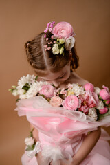 photo session of a girl in a bouquet of fresh flowers