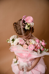 photo session of a girl in a bouquet of fresh flowers