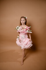 photo session of a girl in a bouquet of fresh flowers