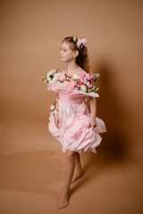photo session of a girl in a bouquet of fresh flowers