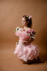 photo session of a girl in a bouquet of fresh flowers