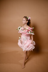 photo session of a girl in a bouquet of fresh flowers