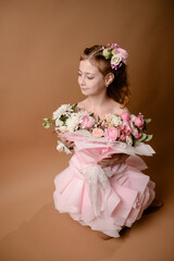 photo session of a girl in a bouquet of fresh flowers