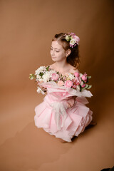 photo session of a girl in a bouquet of fresh flowers