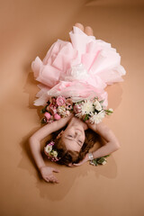 photo session of a girl in a bouquet of fresh flowers