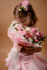 photo session of a girl in a bouquet of fresh flowers