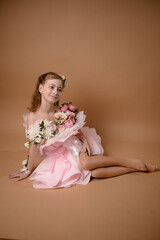 photo session of a girl in a bouquet of fresh flowers
