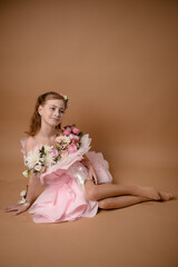 photo session of a girl in a bouquet of fresh flowers