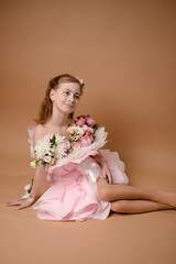 photo session of a girl in a bouquet of fresh flowers