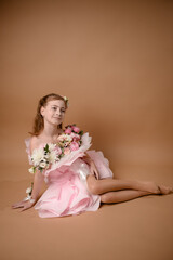 photo session of a girl in a bouquet of fresh flowers