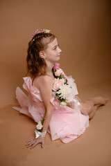 photo session of a girl in a bouquet of fresh flowers