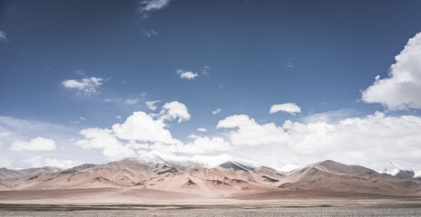 Landscape in the Pamir Mountains of Tajikistan with snow, glaciers, and cliffs, a panorama of...