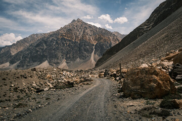 Spectacular landscape of the remote Bartang Valley in Tajikistan. Rugged mountain peaks rising above the glacial river in the heart of the Pamirs (GBAO region).
