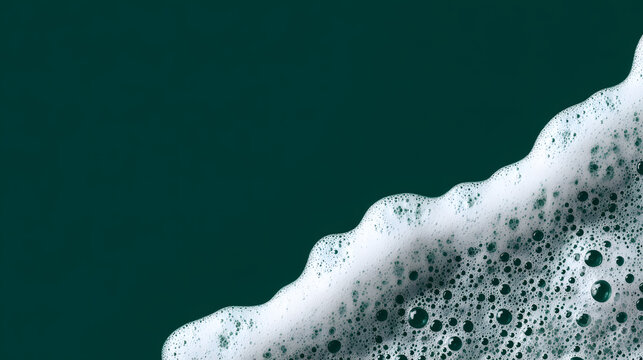 Vibrant green background beautifully contrasted by soft white foam and delicate bubbles, creating a captivating clean texture. This abstract display evokes freshness and purity.