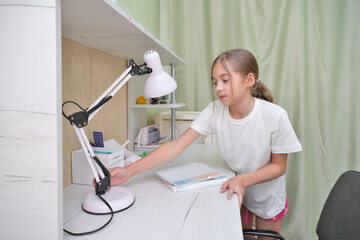 Girl complete school tasks.