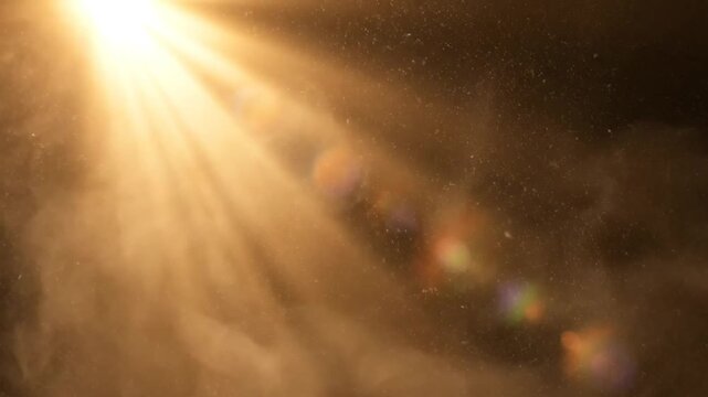 Bright golden sun rays shining through dust particles creating a dreamy atmospheric backdrop