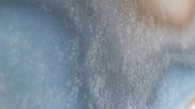 Abstract textured backdrop with a subtle blue and brown color scheme featuring lens flare for creative use.