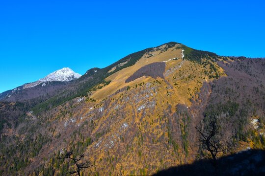 View of Srednji vrh mountain and Hudičev Bor&scaron;t forest and the peak of Storžič in Gorenjska, Slovenia