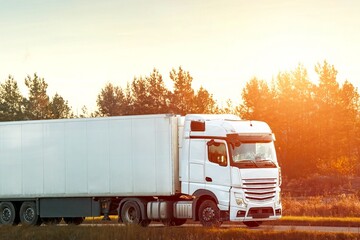 Fast-moving transport truck on asphalt road