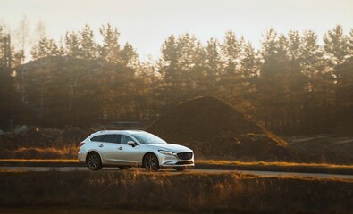 Fototapeta premium Family vehicle traveling green countryside