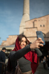 Smiling Traveler Taking a Selfie in a Historic City