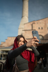 Smiling Traveler Taking a Selfie in a Historic City