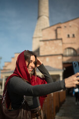 Smiling Traveler Taking a Selfie in a Historic City