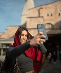 Smiling Traveler Taking a Selfie in a Historic City