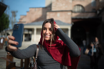 Smiling Traveler Taking a Selfie in a Historic City