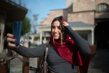 Smiling Traveler Taking a Selfie in a Historic City