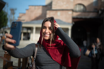 Smiling Traveler Taking a Selfie in a Historic City