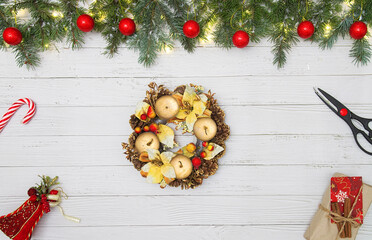 Christmas composition. Christmas gift, candy cane and fir tree branches. Top view, flat lay.