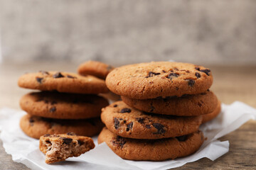 Delicious chocolate chip cookies on table, closeup