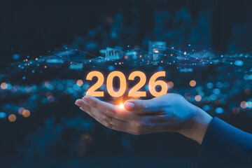 Glowing 2026 year in hand with futuristic background