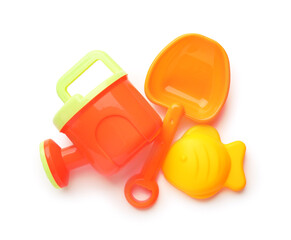 Bright children's beach toys isolated on white, top view