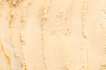 Tasty vanilla ice cream as background, closeup