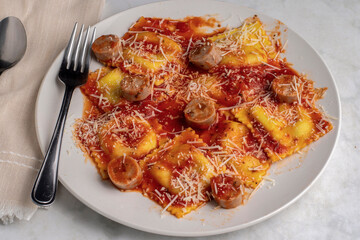 spinach and mushroom ravioli top with chicken sausage
