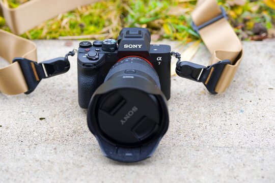 Close-up of brand new Sony Alpha 7 V photo camera with Sony G-Master 14-70 mm II photo lens outdoors at terrace on a foggy autumn day. Photo taken December 13th, 2025, Zurich, Switzerland.