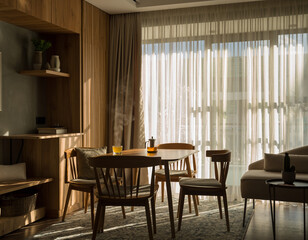 Fototapeta premium Minimalist Dining Room Interior with Soft Natural Sunlight