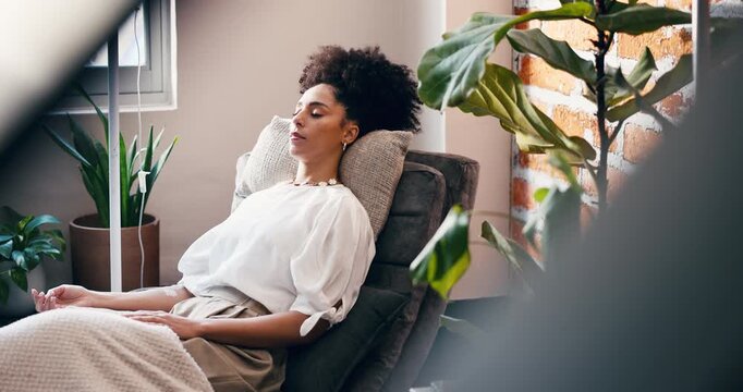 Woman, relax and wellness in clinic with iv drip for healthcare, detox and hydration benefits. Person, sleeping and rest in medical center with intravenous fluid for nutrients, vitamins and minerals.
