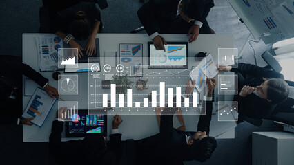 A diverse business team engages in a data analysis session during a meeting in a sleek modern office, focusing on charts, graphs, and digital presentations. Trope