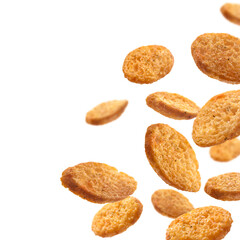 Bread croutons levitate on a white background