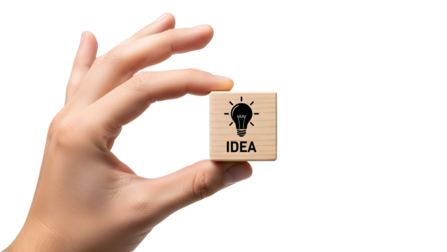Hand holding a small wooden block featuring a lightbulb icon and the word “IDEA,” symbolizing creativity, innovation, brainstorming, and business inspiration. - Powered by Adobe