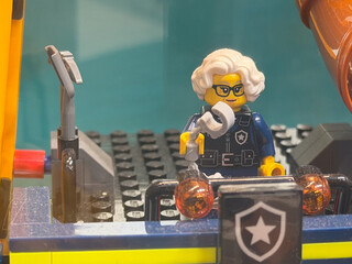 Fototapeta premium LEGO Police Officer Figure with Microphone