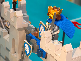 Fototapeta premium Lego king on castle wall with sword