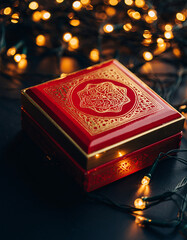 Red luxury gift box with golden ornament and lights