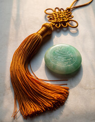 Golden Chinese knot with jade stone prosperity ornament