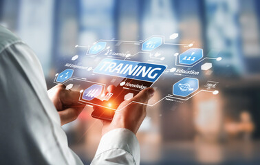 A professional examining innovative training concepts using modern technology tools for effective skill development and knowledge enhancement in a digital workspace. Tessel