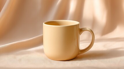 Stylish beige ceramic coffee mug placed on soft fabric with gentle shadows, perfect for showcasing modern home decor or cafe aesthetics in photography