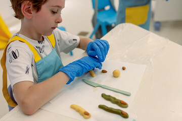 Children's Halloween baking masterclass where kids learn to shape and decorate themed "witch finger" cookies, combining basic baking skills with creative, hands-on holiday fun. Kids' workshop.